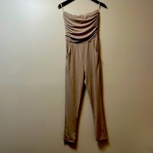 It’s a small onesie, brown, and it has pockets. brand is street smart society